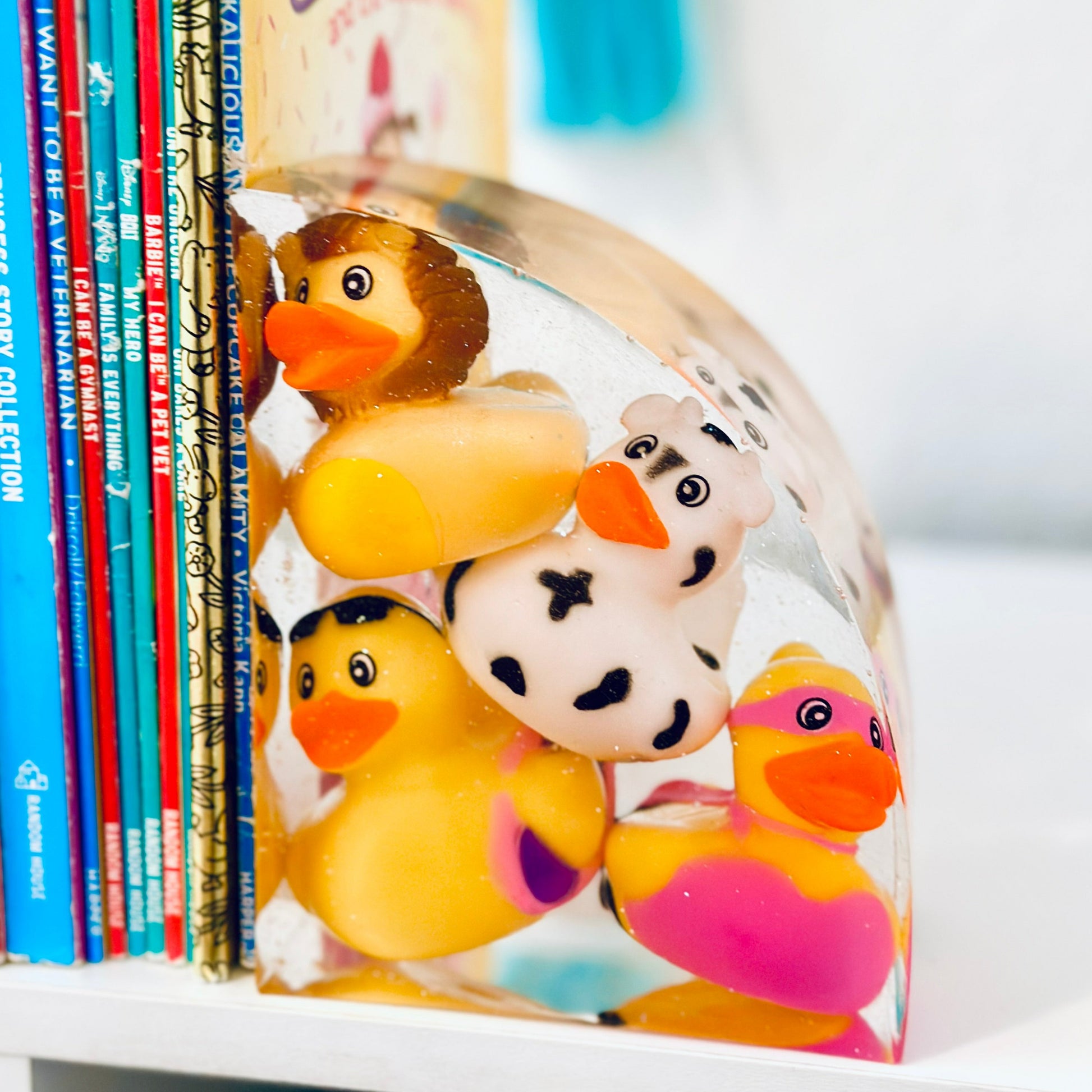 Kids' room desk featuring the glittery resin ducky bookends.